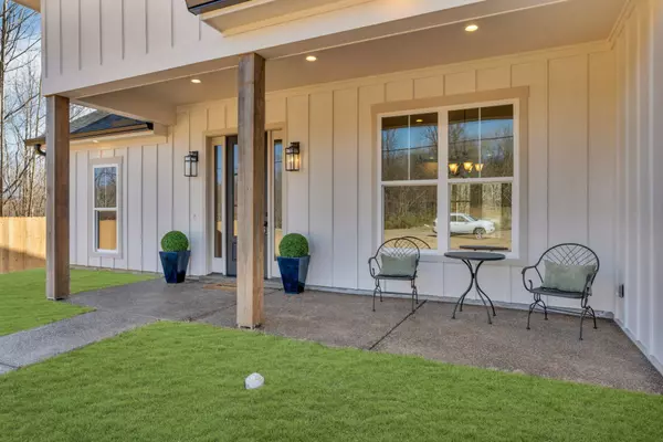 Entryway: Welcoming front entrance with a modern farmhouse door and inviting curb appeal.