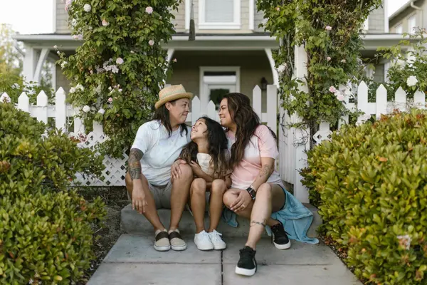 Couple arriving at the front door of a suburban Mississippi home