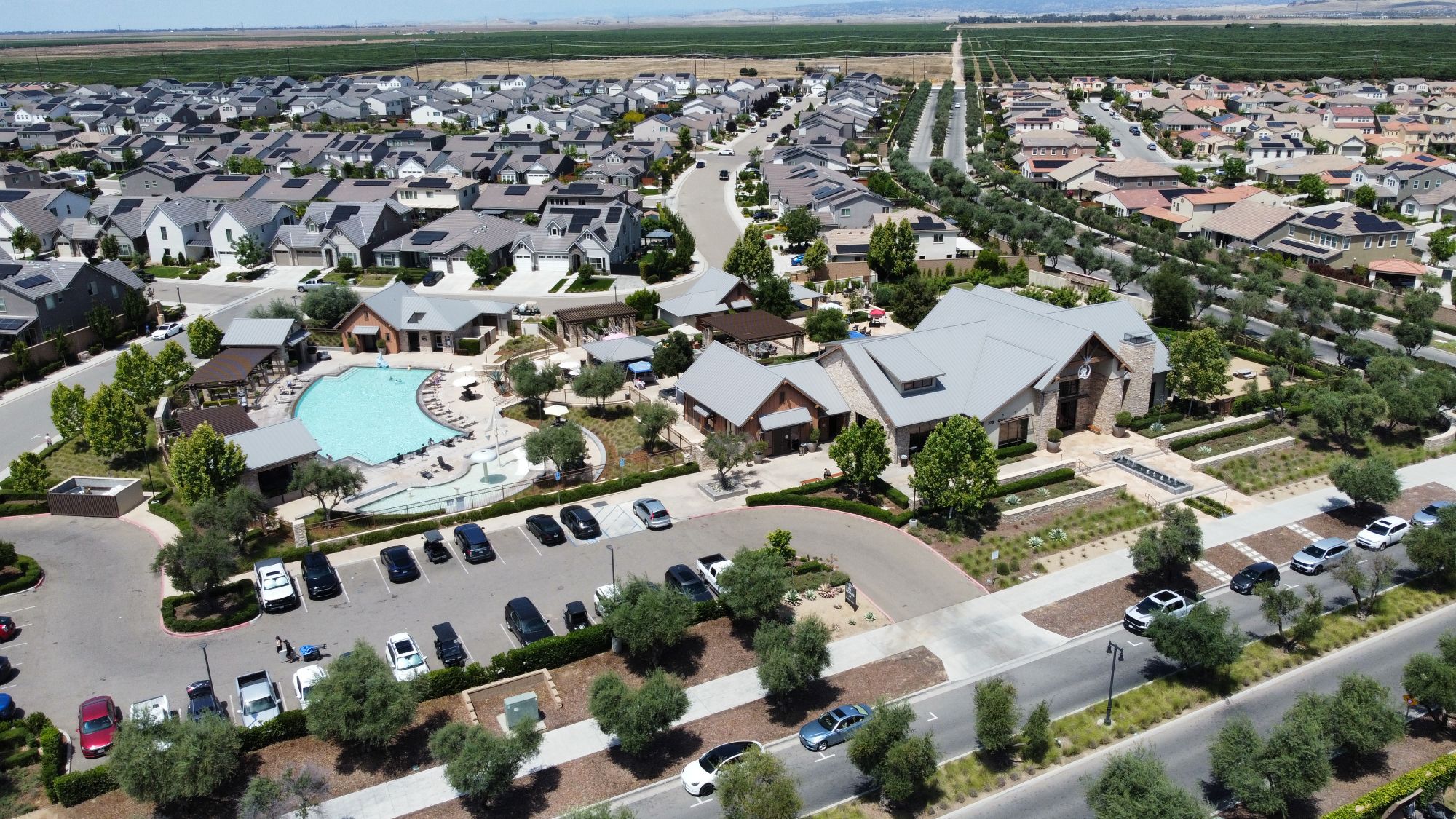 Aerial view of the Riverstone clubhouse, pool and surrounding homes in Madera County