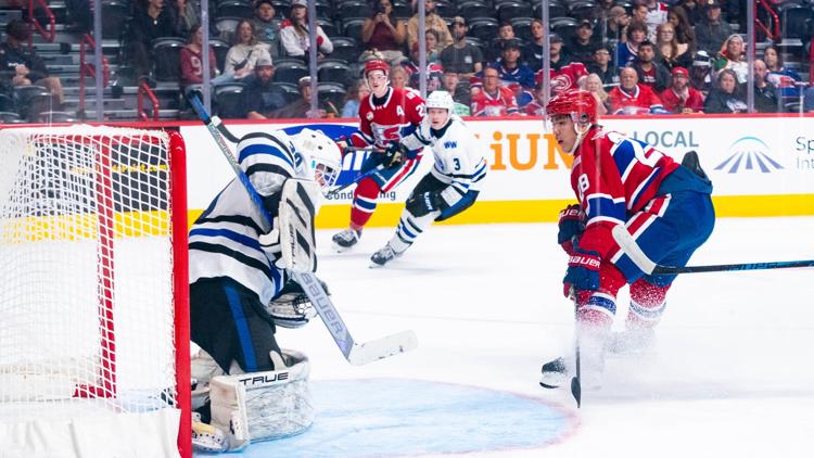 Fans cheering at a Spokane Chiefs hockey game, highlighted by Haydn Halsted as a fun thing to do in Spokane WA