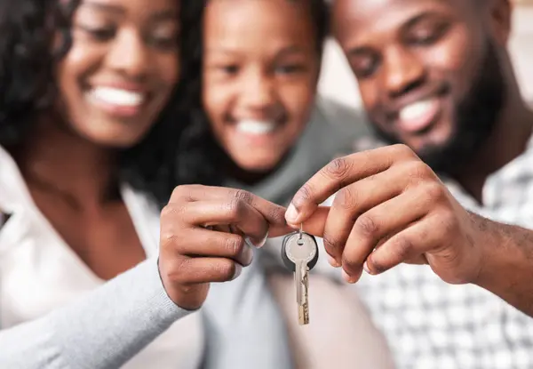 People getting keys to a home