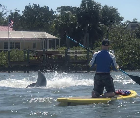 Paddleboarding in calm waters of New Smyrna Beach, Florida