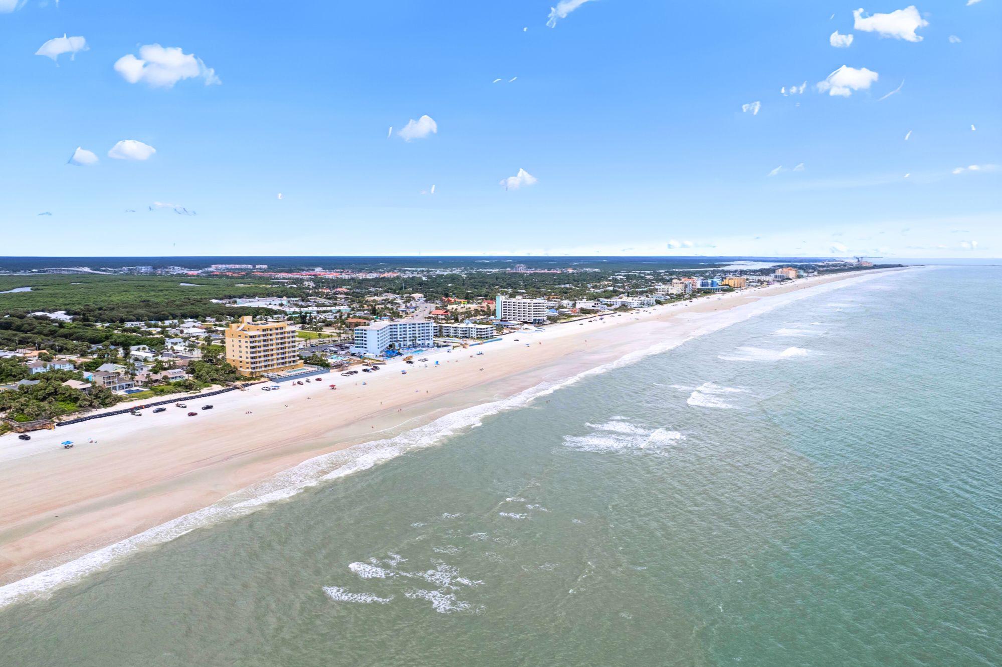 Wide sandy shoreline along New Smyrna Beach on Florida’s east coast