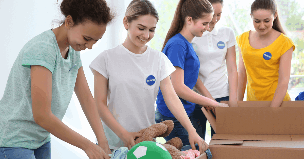 Family & friends sorting through items while helping their grandparents downsize