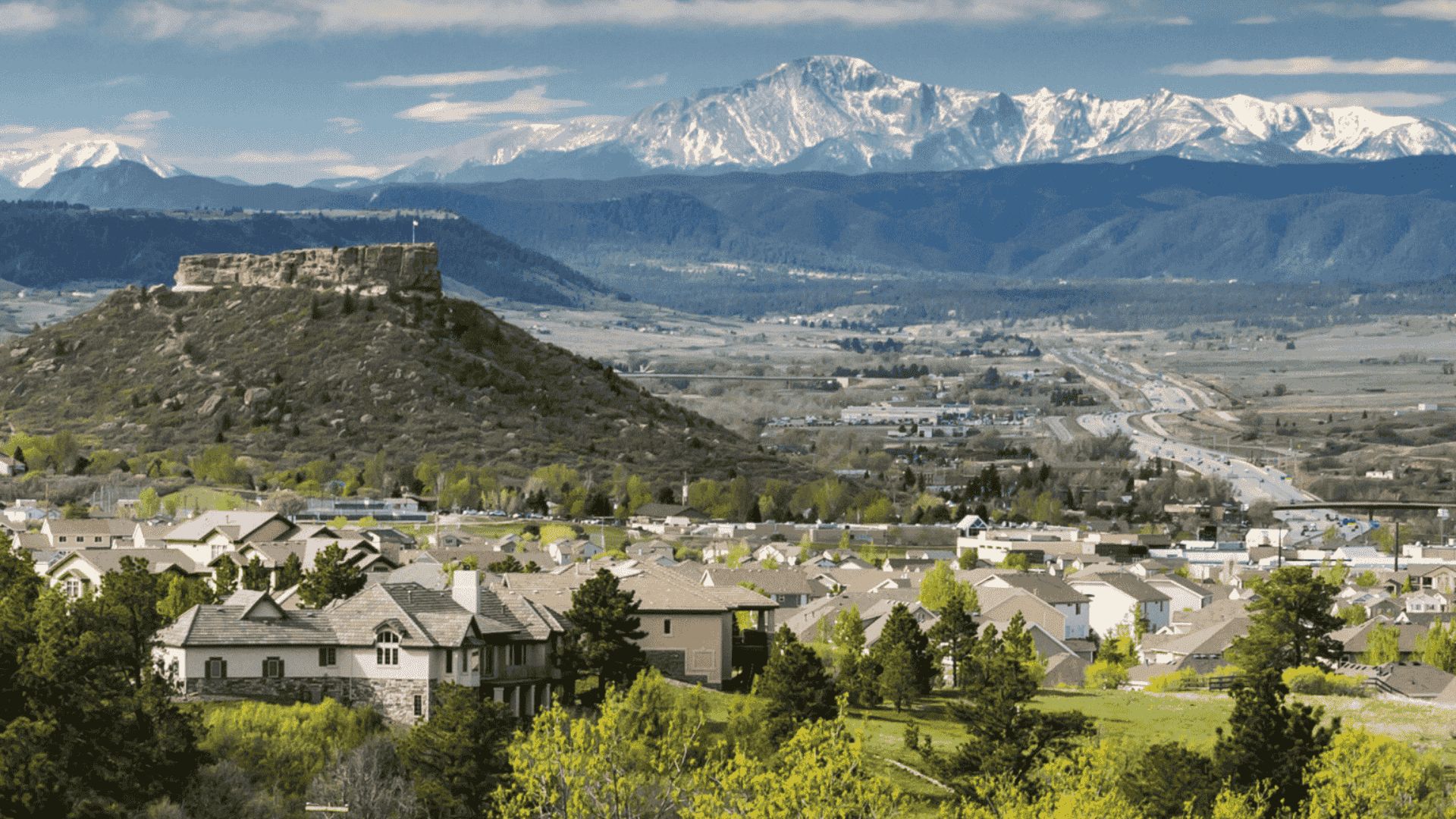 “Aerial view of The Keep in Douglas County with rolling hills and mountain scenery.