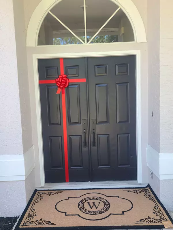 Installing the E&V Red Bow & Ribbon on Our Clients' Front Doors,Stacy Dinucci Kitchell