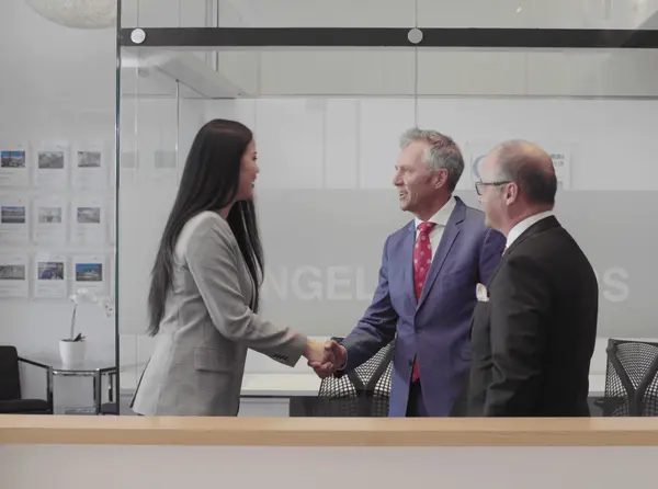 Clients advisor shaking hands men woman