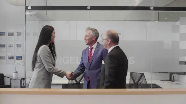 Clients advisor shaking hands men woman
