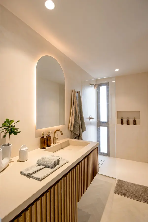 Spa-inspired bathroom with refined finishes at Aflora Tulum residences