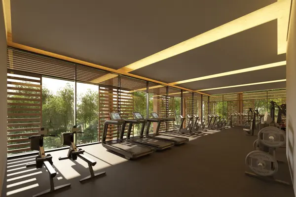 Fully equipped fitness center with modern equipment in a luxury resort setting