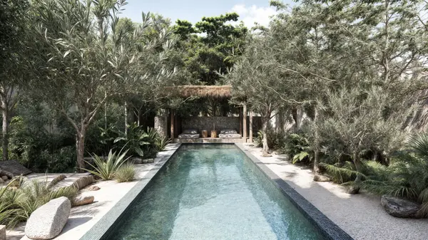Resort-style pool and outdoor lounge areas at Ensamble Tulum