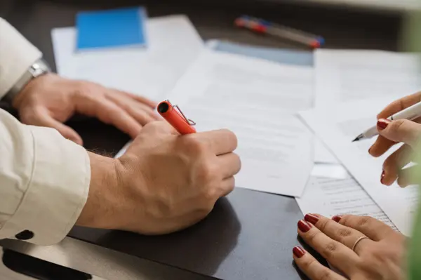 Canva - Real Estate Broker and Buyer Signing Documents