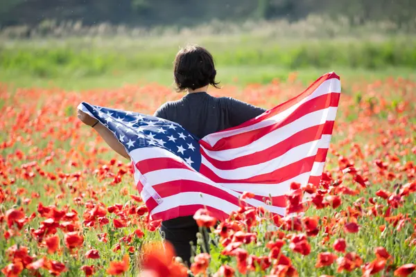 patriot-woman-holding-the-american-flag-on-the-4th-2025-03-24-19-46-53-utc