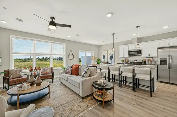 Open-concept living room and kitchen in a Prairie Ridge new construction home