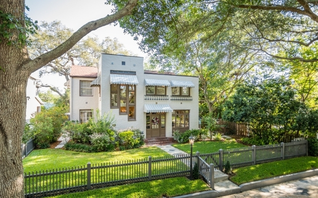 Historic two-story home with mature oak trees on a tree-lined street in Old Northeast, St. Petersburg