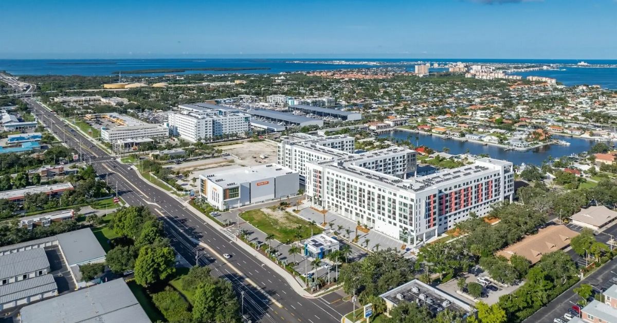 Aerial view of new apartment and retail development along the waterfront in St. Petersburg's Skyway Marina District