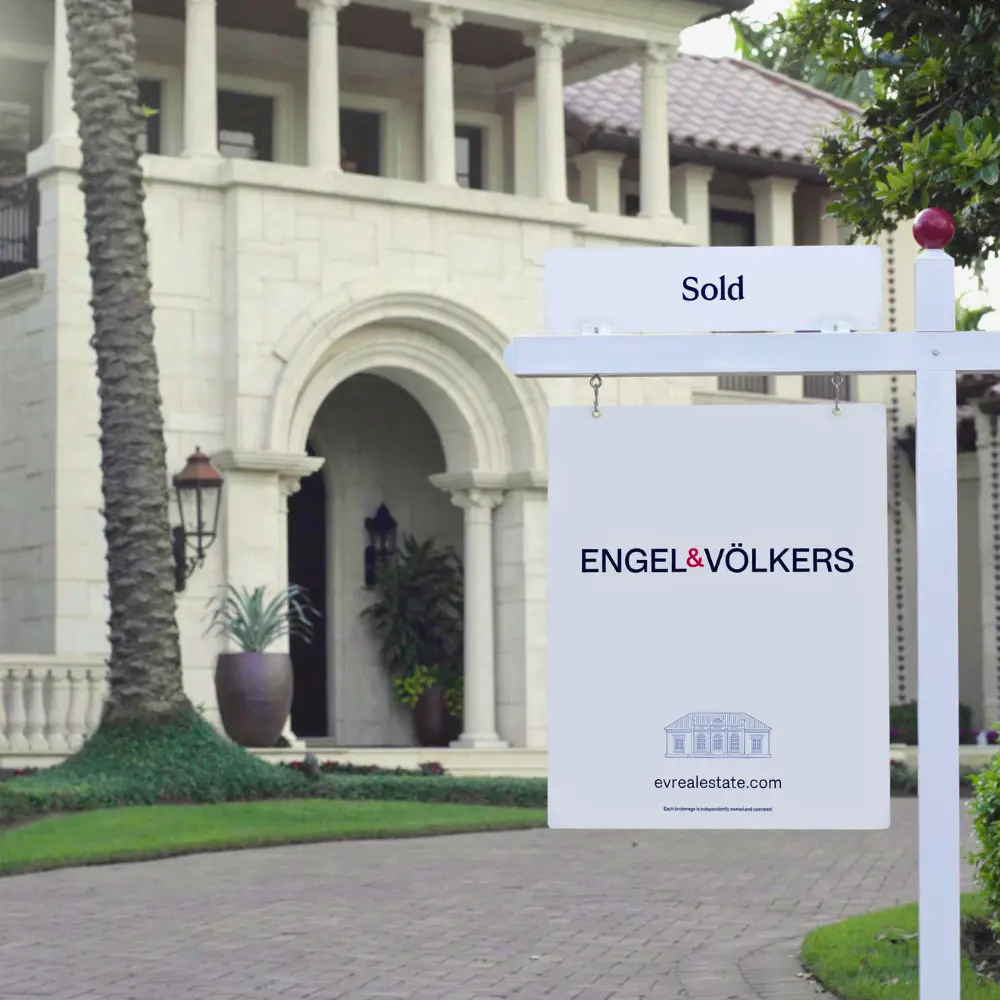Engel and Volkers sold sign in front of a luxury home - Kirby Drake real estate advisor Tampa Bay
