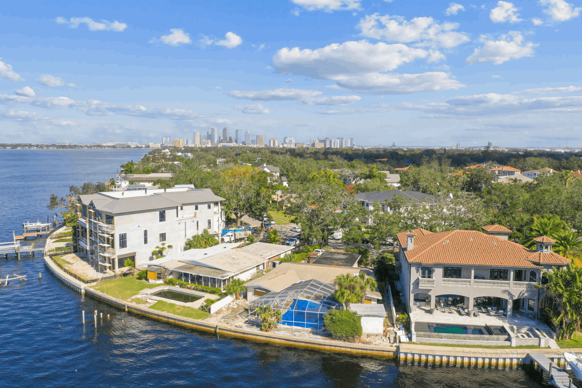 Waterfront homes on Davis Islands with the Downtown Tampa skyline in the distance