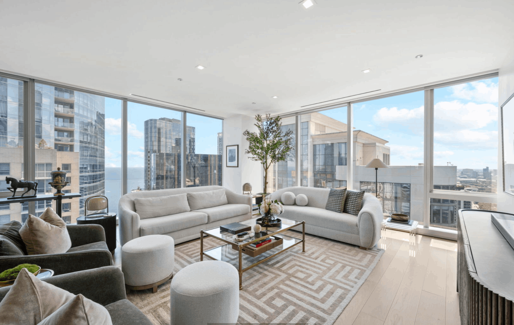 Living room at St. Regis Chicago #3109 with floor-to-ceiling windows and skyline view.