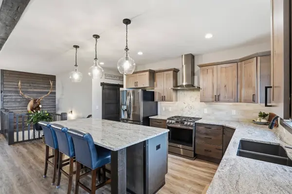 6621 Green Mountain Court, Spearfish, SD grounded luxury kitchen with granite and views out window.