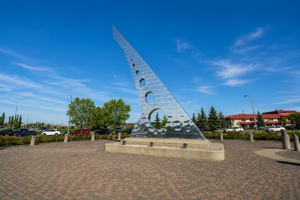 residential properties in [your area] - aerial view of Calgary riverfront condos and paths on a bright day