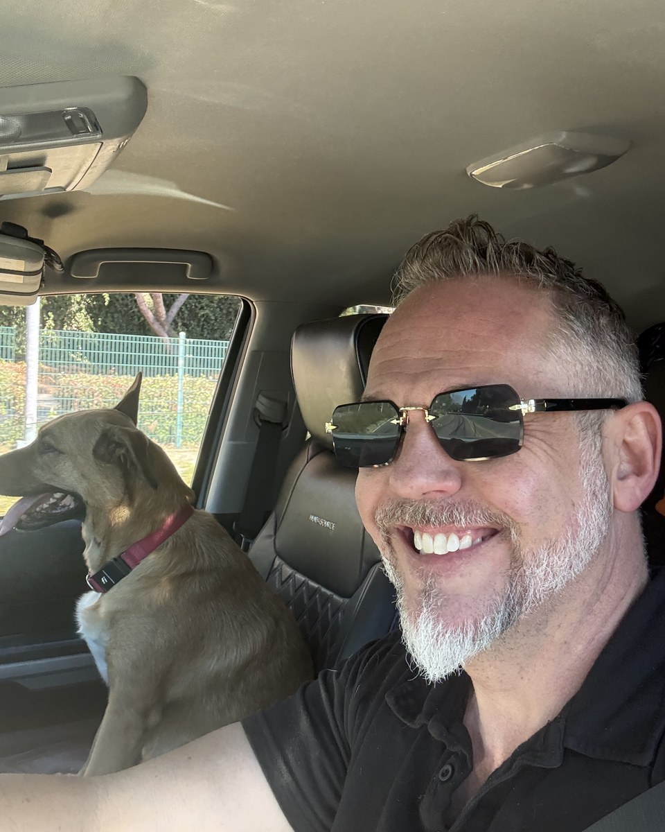 Randy Plaice, Team Leader, Broker Associate, with his dog Karma