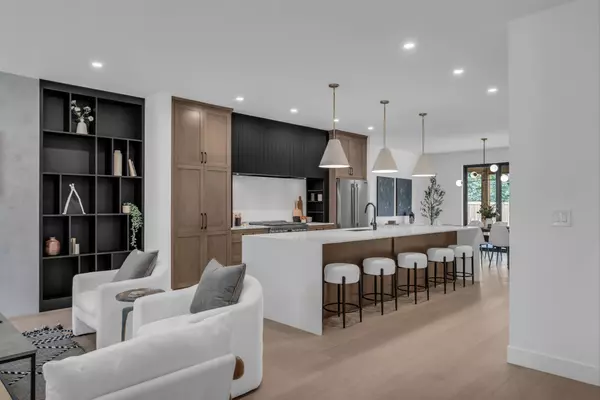 Modern open-concept Saskatoon home with kitchen and living space, ideal for showcasing interiors that attract today’s buyers.