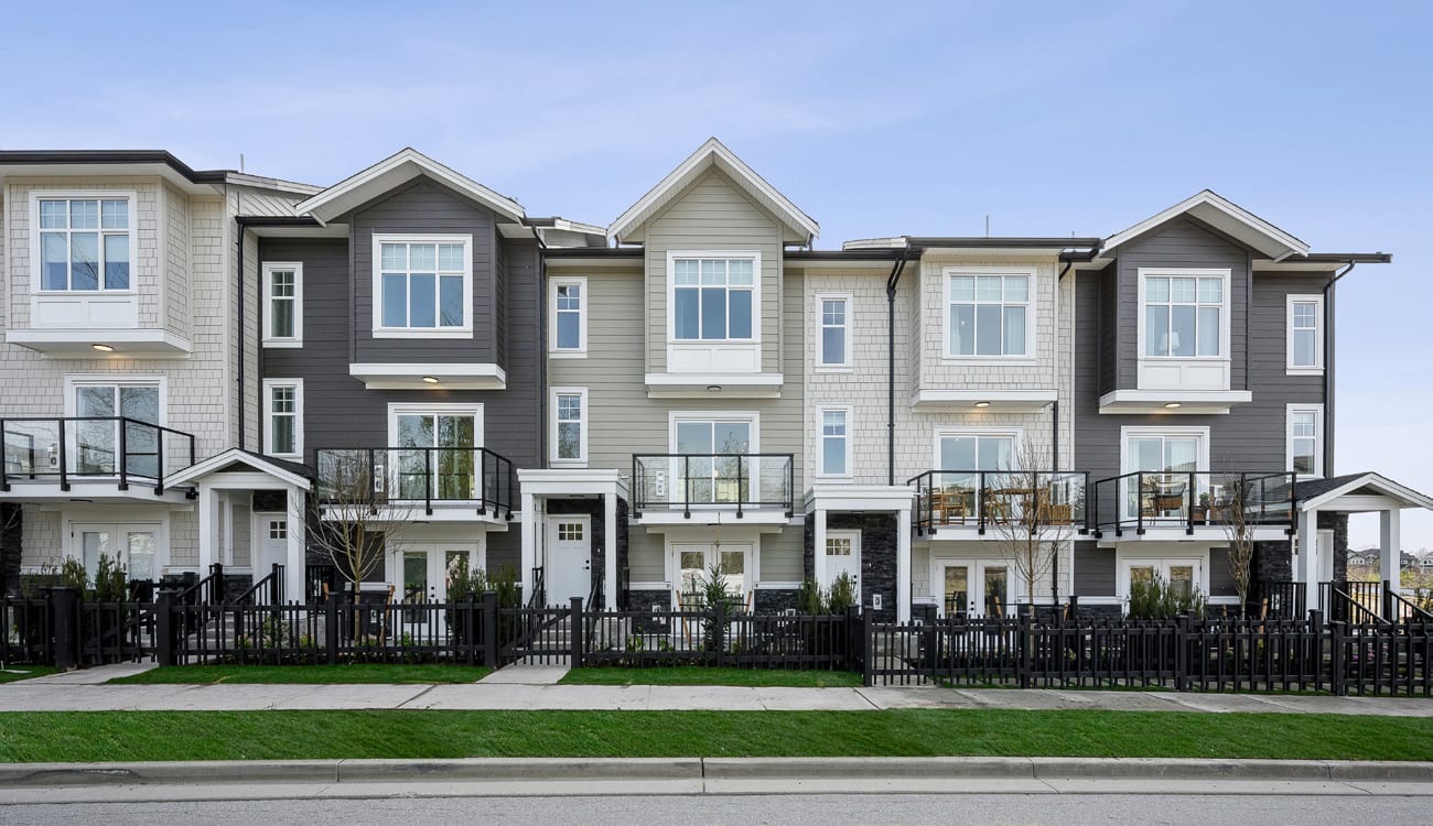 Griffon three-storey townhome row with fenced front yards in Willoughby, Langley