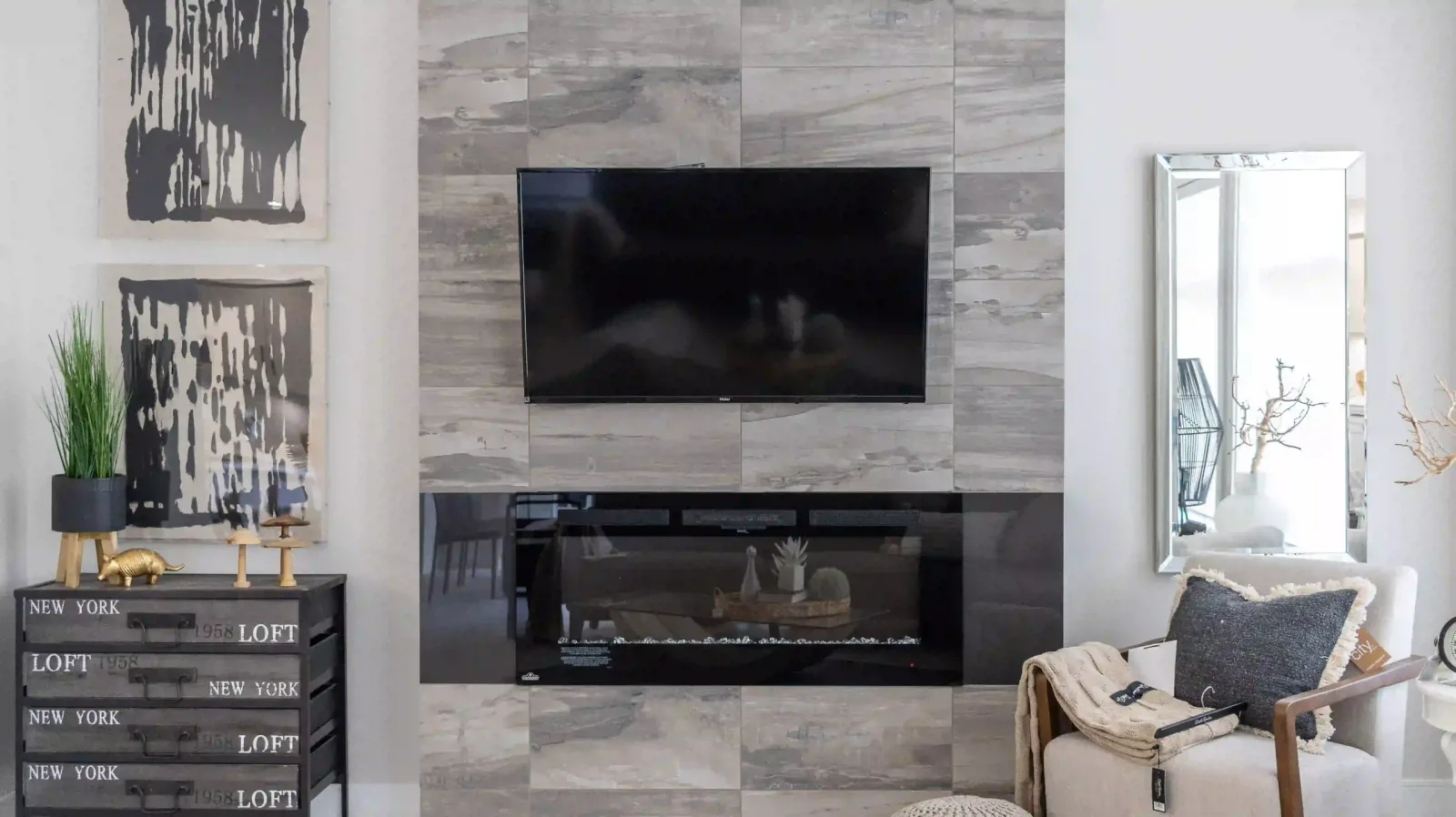 Electric fireplace with a tile surround in a Liberty Encore living room