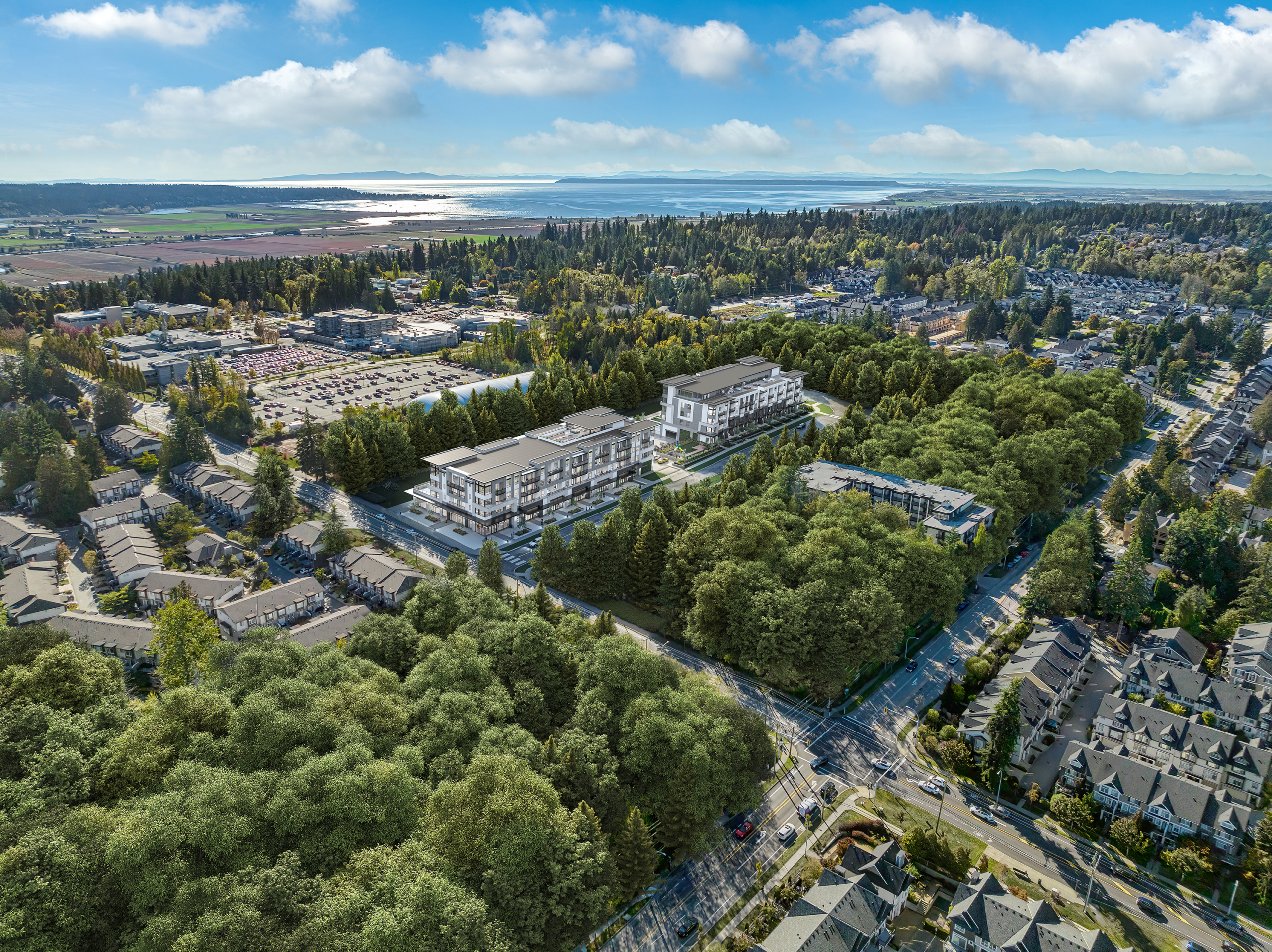 Drone aerial of Amson Bloc, a new pre-sale low-rise condo community in South Surrey, showing the scale of sub-$600k new construction in the Fraser Valley