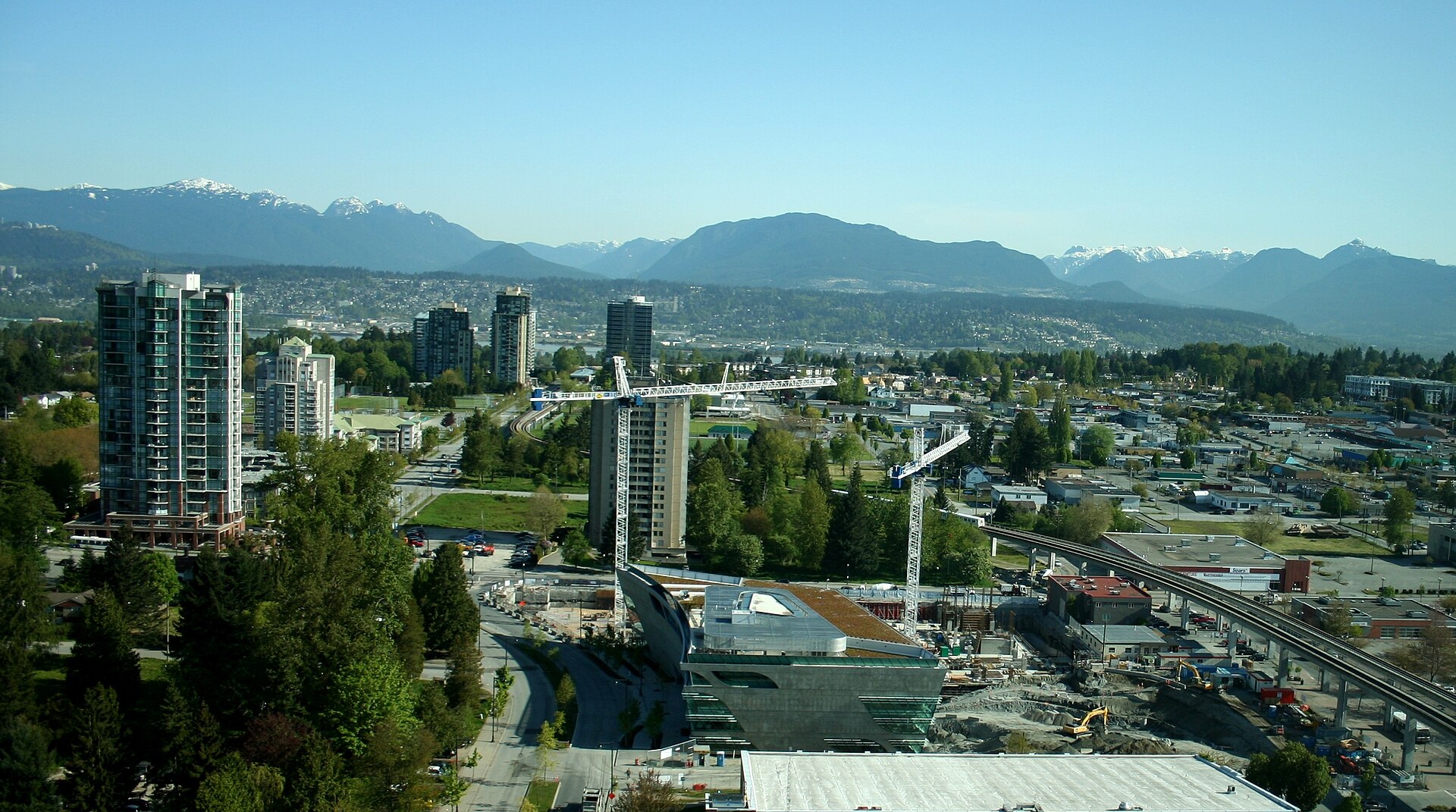 Drone view of Surrey City Centre with cranes and towers under construction, where most Fraser Valley pre-sale buyers pay their deposits