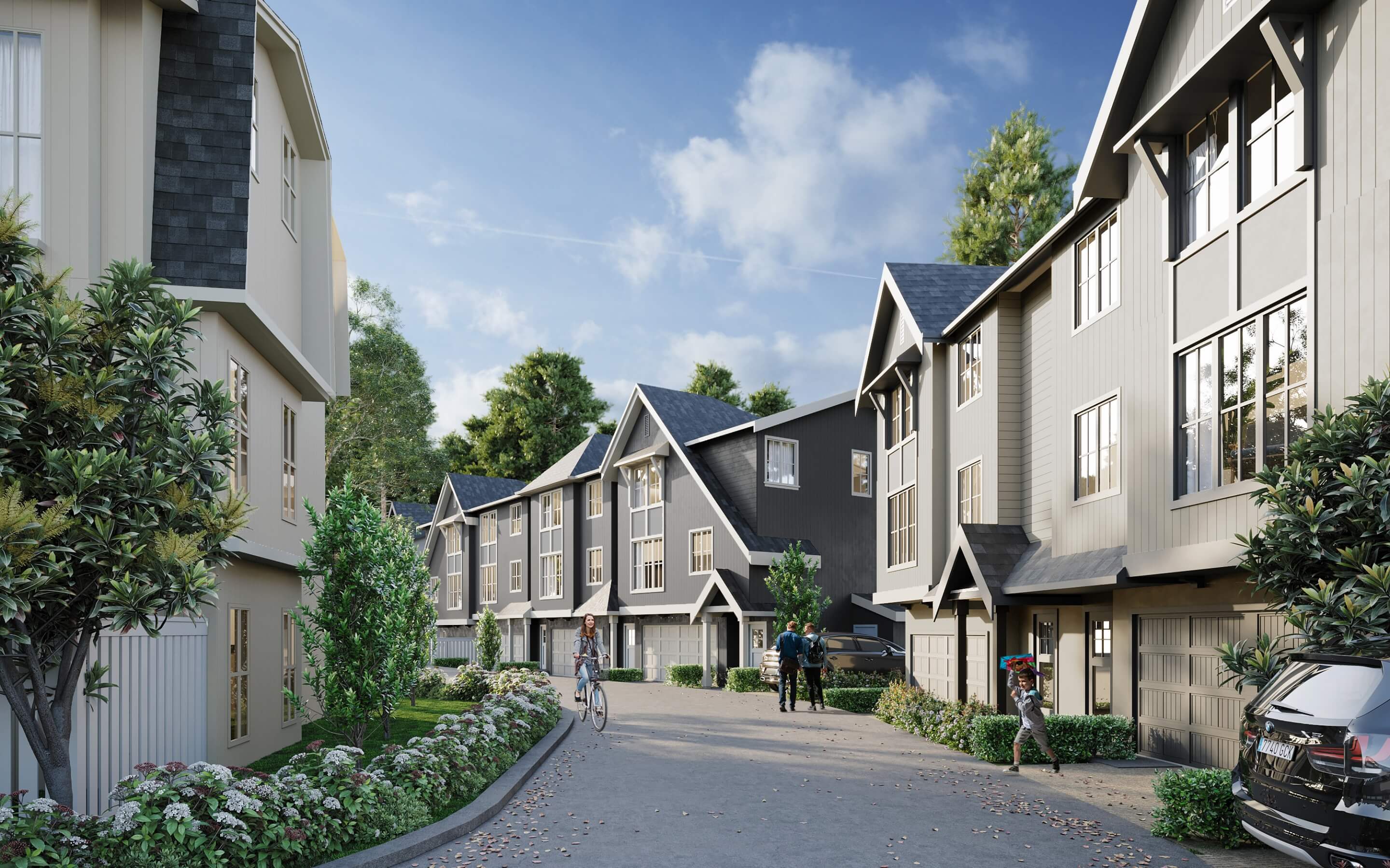 The Falls at Kanaka Springs laneway render showing rear-loaded townhome garages, gabled rooflines, and residents cycling through the community