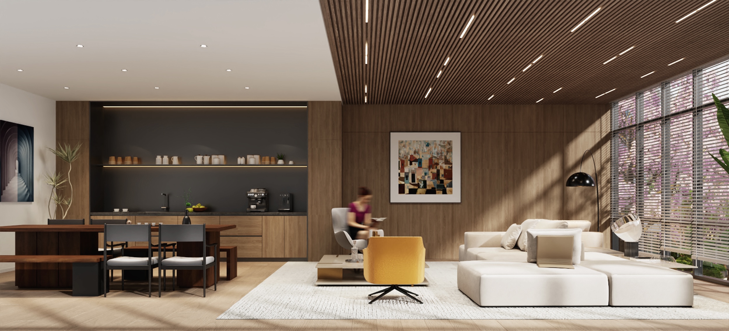 Kamilia resident lounge with full kitchen, seating, and flexible entertainment space