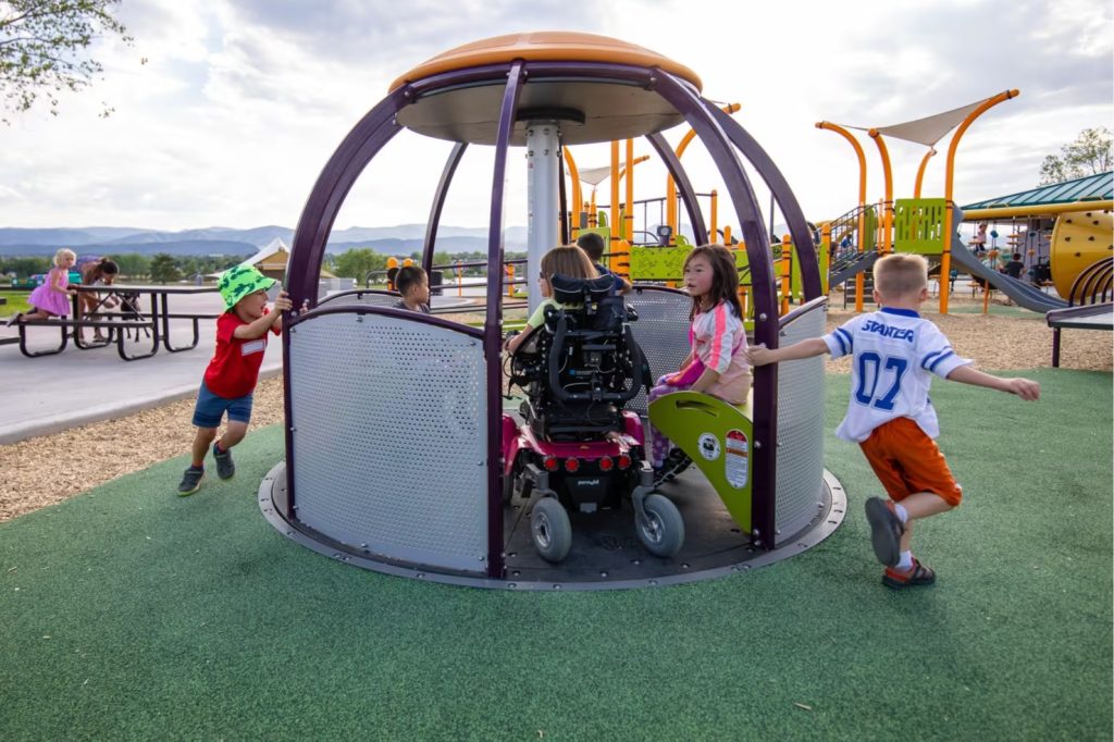 Yorkson Community Park accessible playground with mountain views in the background