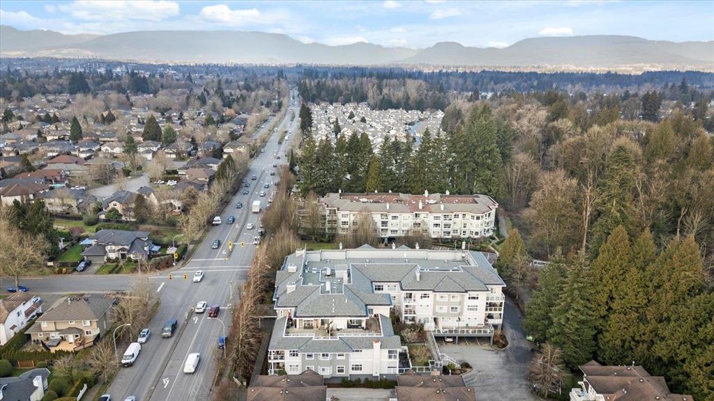 Drone view over Walnut Grove in north Langley, the family-focused neighbourhood between the Fraser River + the Trans-Canada Highway