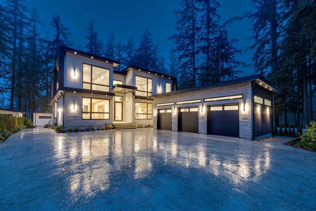 A luxury single-family detached home on a tree-lined Sunnyside Park street, the higher-end product that defines this premium South Surrey pocket