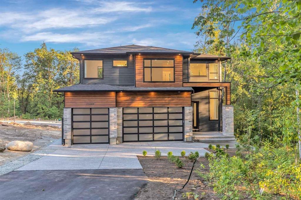 North Maple Ridge rural detached home with mountain backdrop, mature trees, & gravel driveway