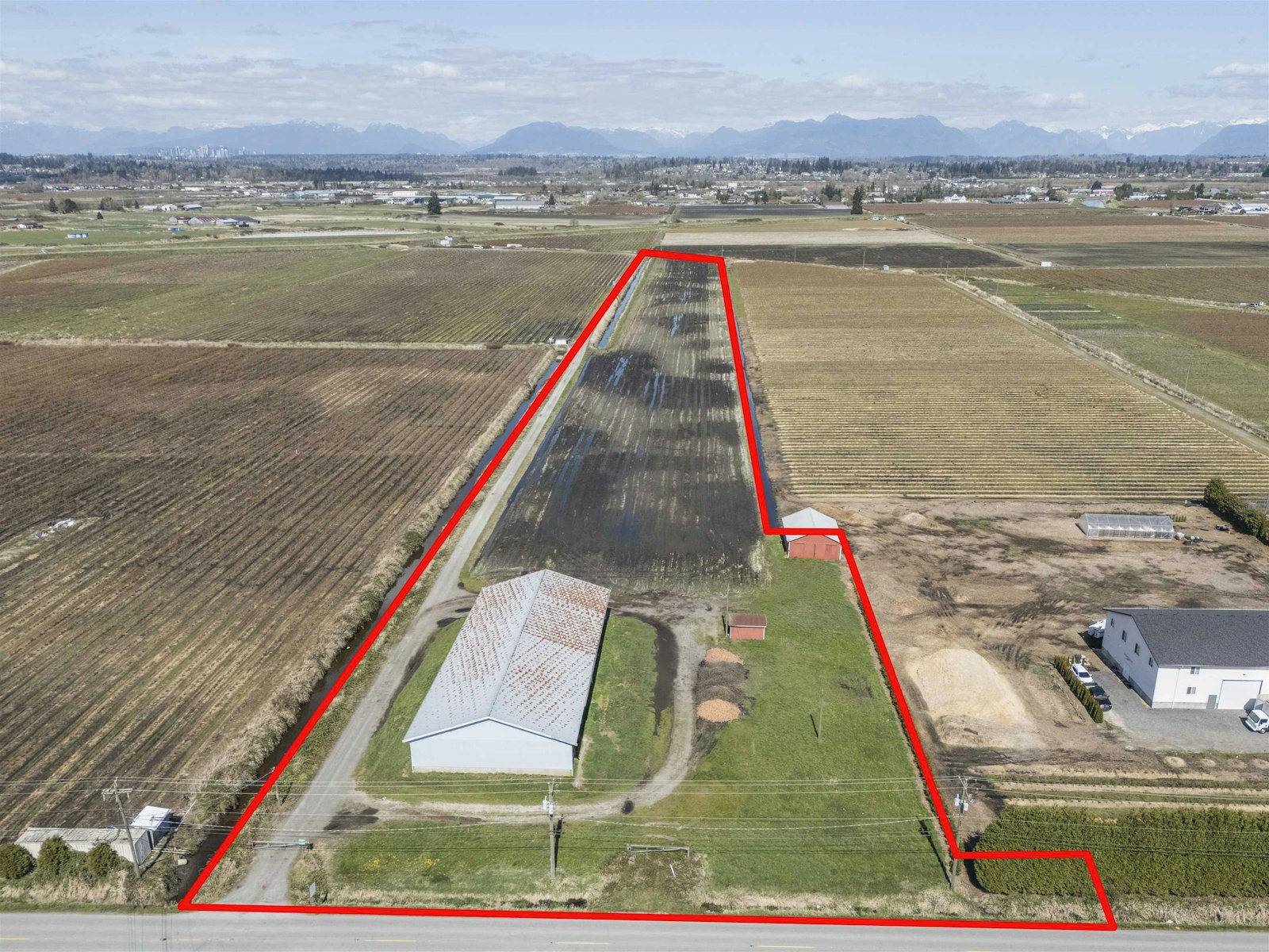 Serpentine 11-acre working farm drone view