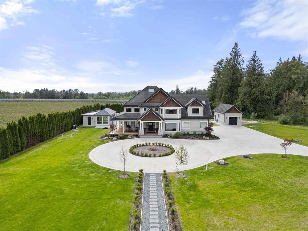 Resort-style estate with pool & multiple outbuildings on a Glen Valley acreage