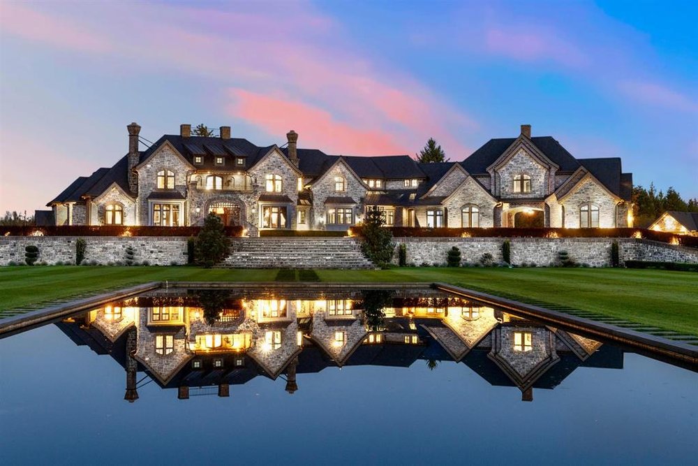 Custom estate with circular driveway beside a vineyard in Glen Valley Langley
