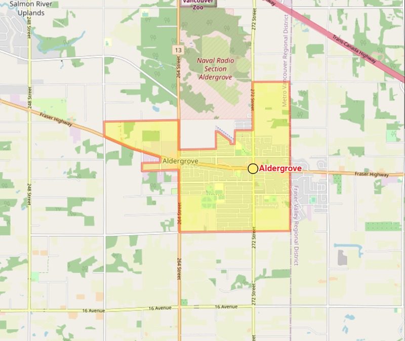 Street map of the Aldergrove area with the community shaded yellow, Fraser Highway crossing it east to west, 264 Street and 272 Street running north to south, and the Trans-Canada Highway to the north