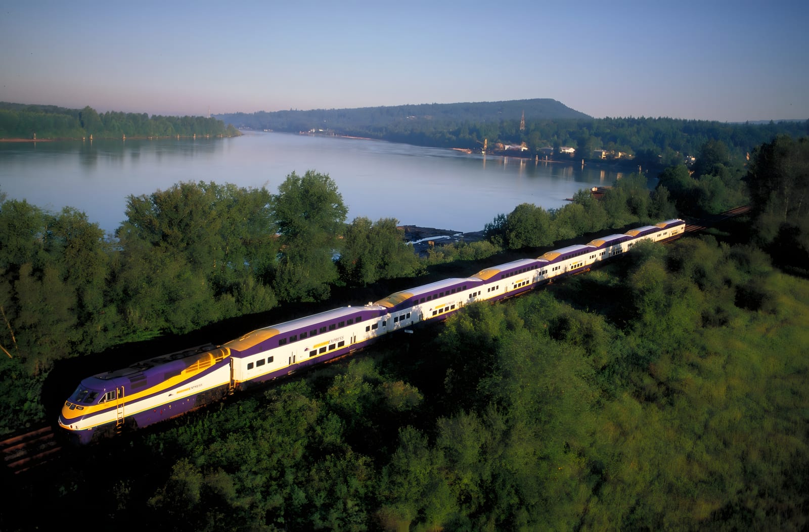 A West Coast Express train running beside the Fraser River