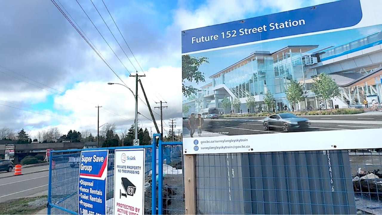 Rendering of the future 152 Street SkyTrain station on a construction hoarding in Surrey