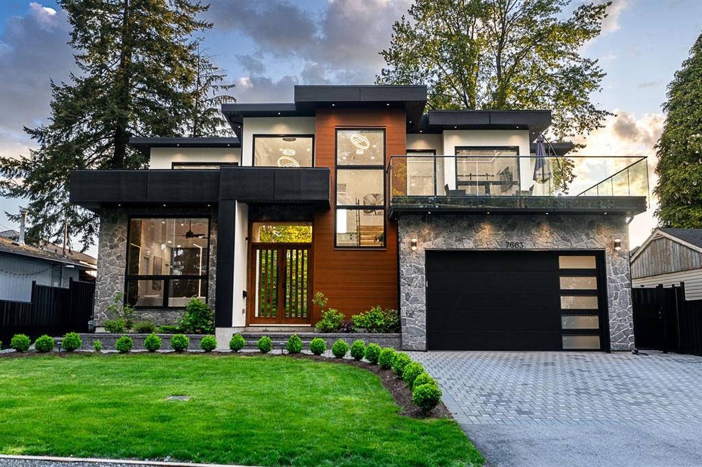 A newer 2-storey detached home with a paved driveway in West Newton, Surrey