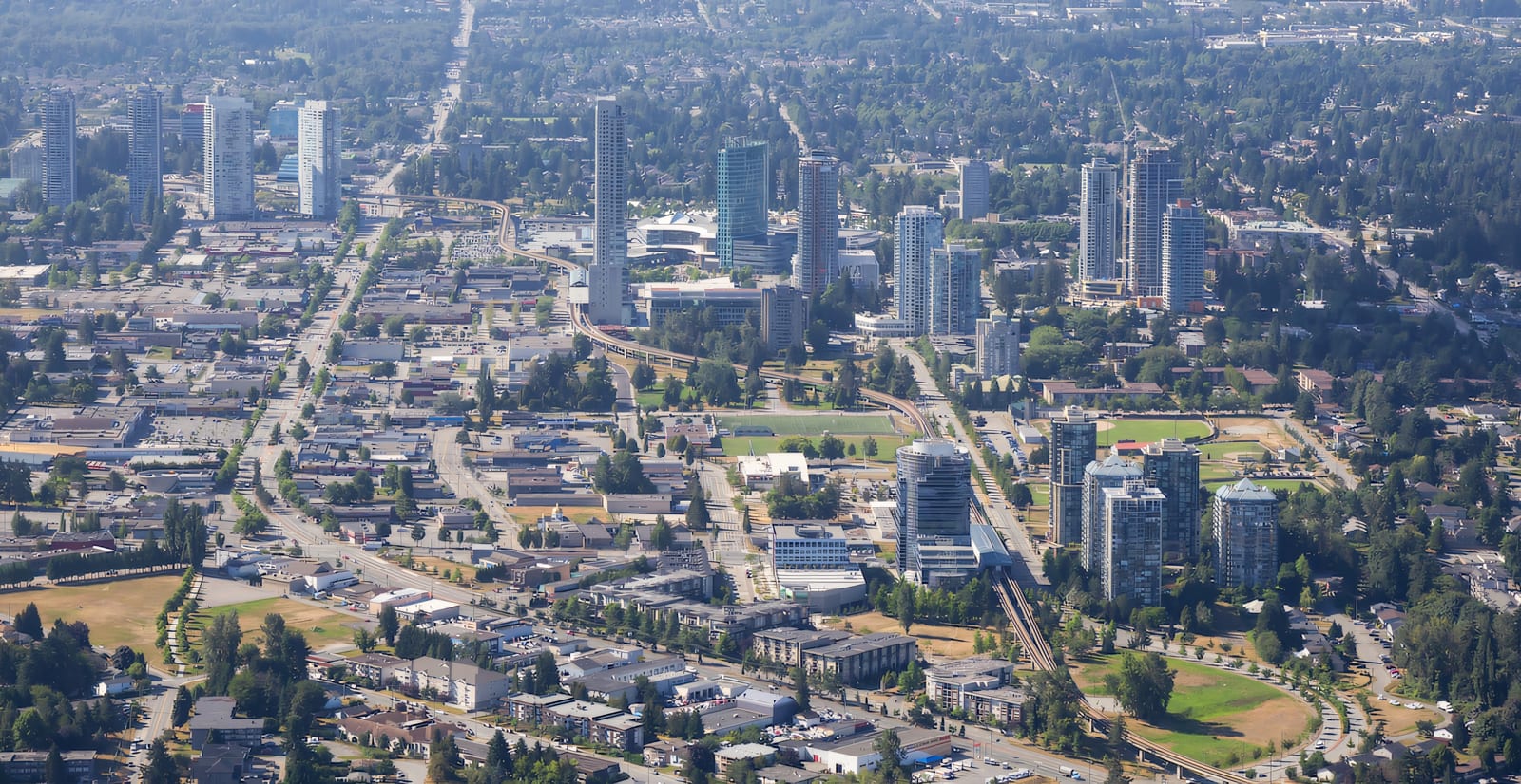 Aerial view of Surrey City Centre along King George Boulevard and the SkyTrain line
