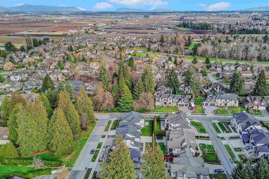 Aerial view of estate homes in Morgan Creek, South Surrey, toward farmland