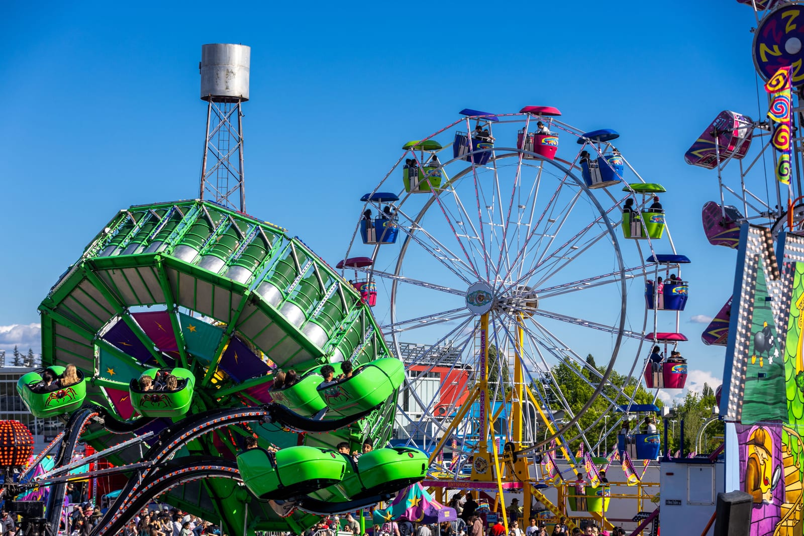 Midway rides and the Ferris wheel at the Cloverdale Rodeo and Country Fair