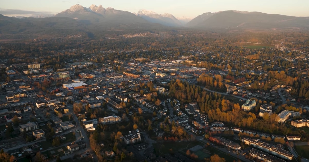 Aerial view over central Maple Ridge toward the Golden Ears at golden hour