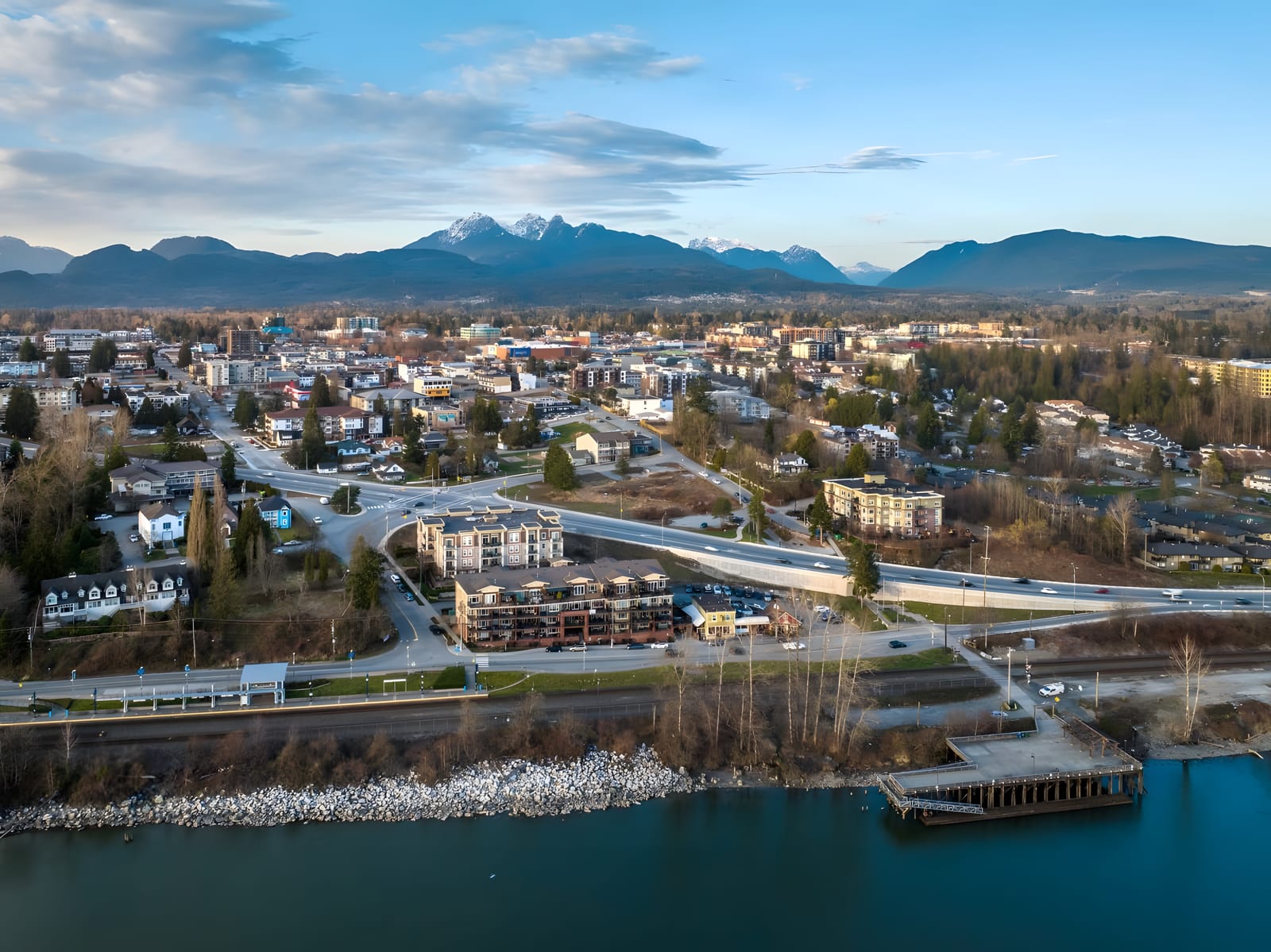 Aerial view of Port Haney, the West Coast Express platform and the Fraser River wharf, with the Golden Ears beyond