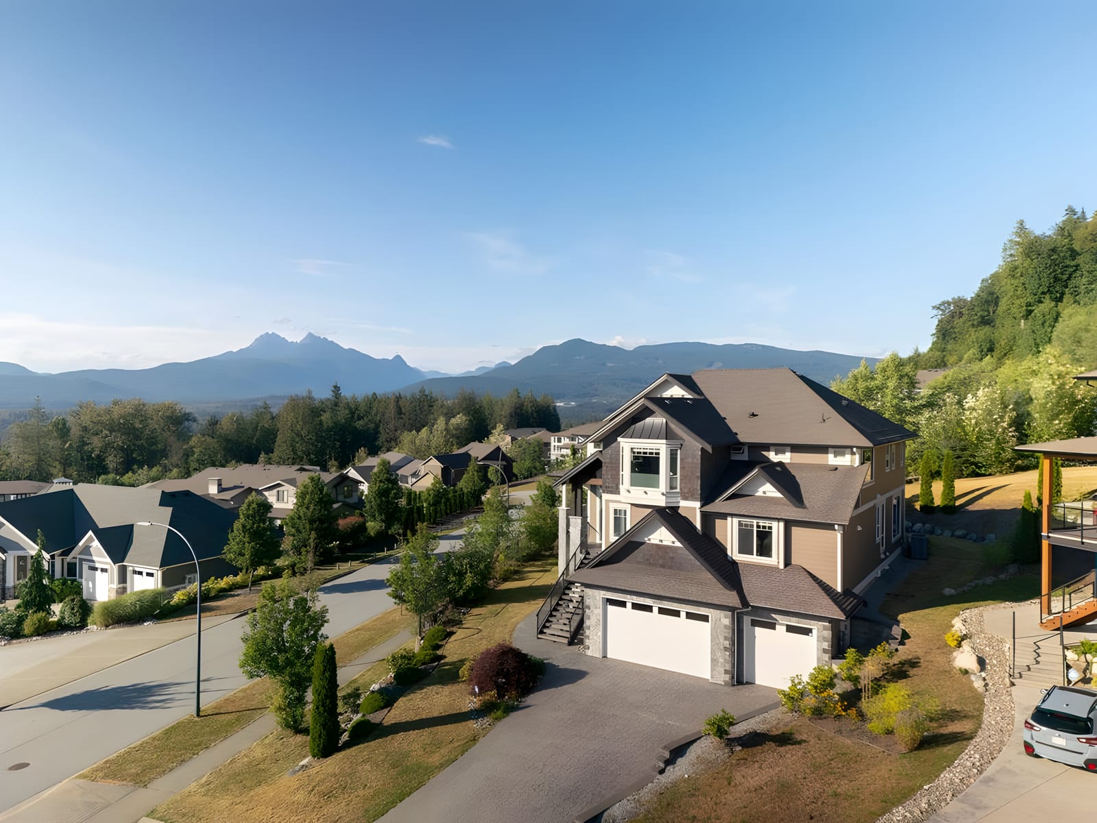 A new detached home on a Thornhill street in Maple Ridge, with the Golden Ears beyond